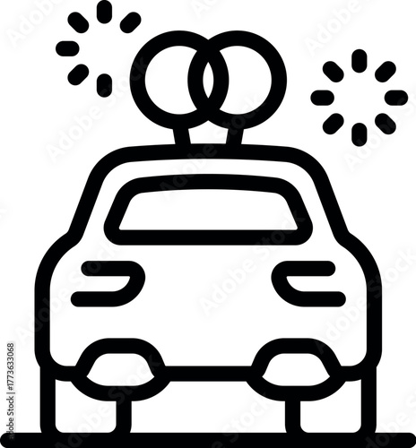 Car decorated with wedding rings and fireworks, celebrating a just married couple