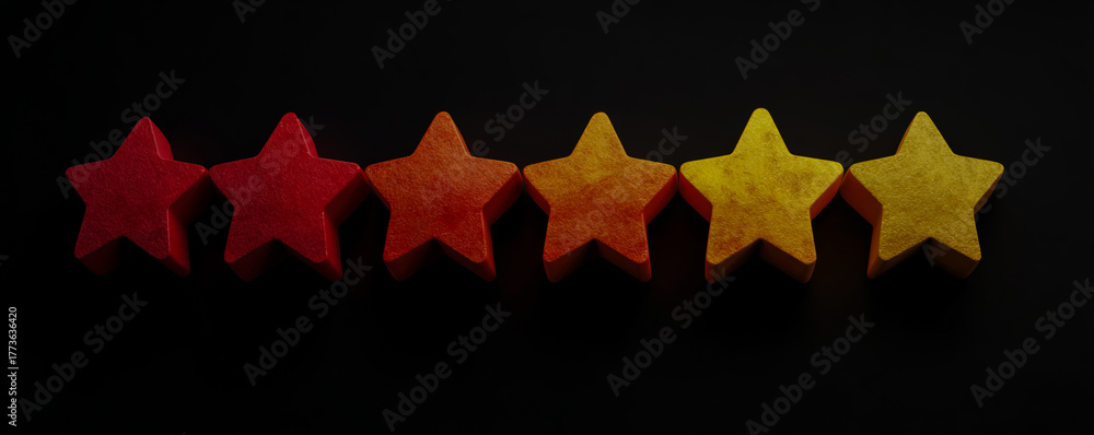 Fototapeta premium Five glowing star shaped objects arranged in a row against a dark background
