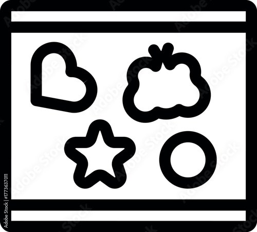 Different shaped pastry cutters lying on a table, ready for baking delicious cookies