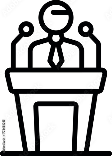 Politician giving a speech at a podium with microphones, possibly addressing a political gathering or conference