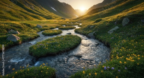 Fototapeta Naklejka Na Ścianę i Meble -  Serene valley river flows through meadows with sunrise on distant mountains
