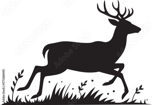 Silhouette of a running deer with antlers in tall grass