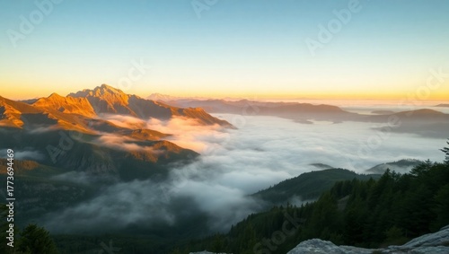 Stunning mountain sunrise shrouded in dreamy rolling fog