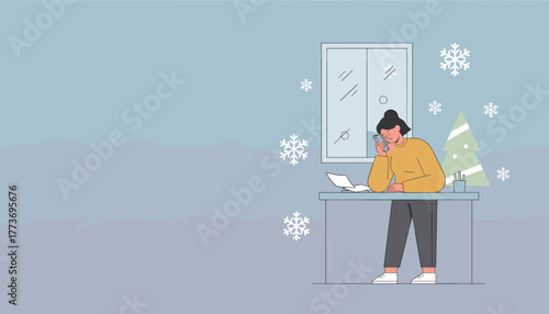 Woman on smartphone at desk during winter holidays Christmas tree and snowflakes suggest seasonal work