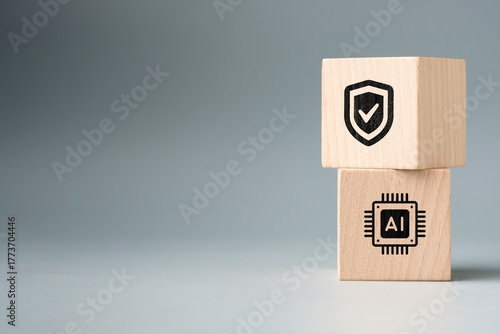 Wooden blocks with AI chip and security shield icons symbolizing artificial intelligence safety, cyber security, and data protection in modern digital technology