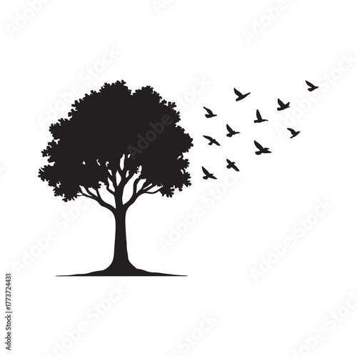 A symbolic black and white silhouette of a solitary tree with a flock of birds flying away from its leaves, representing freedom, life, change, hope, and new beginnings in nature