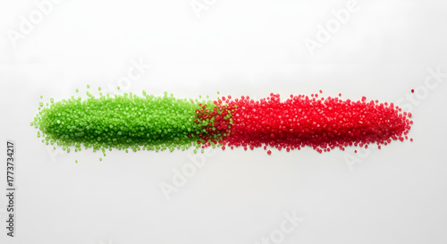 01_Flat lay of green and red sugar crystals arranged in a line. Vast white table negative space.