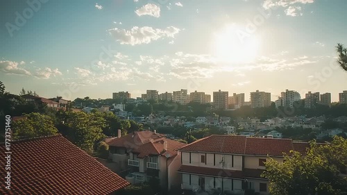 Wallpaper Mural Residential rooftops leading to distant urban high-rise buildings under bright sun Torontodigital.ca