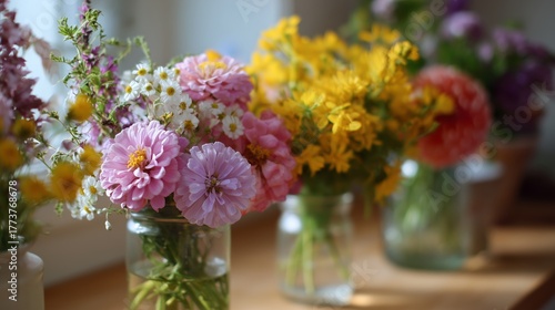 Wallpaper Mural Colorful bouquet of wildflowers in jars on a wooden table during sunny morning Torontodigital.ca