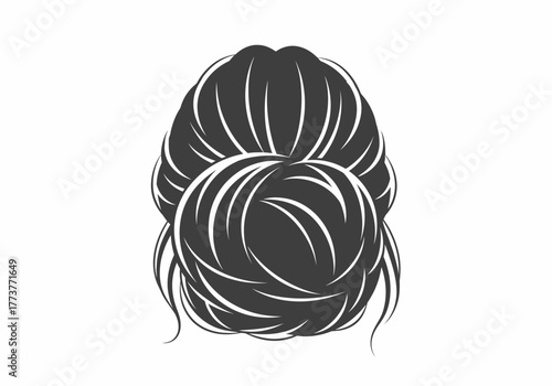 A womans hair is styled into a messy bun