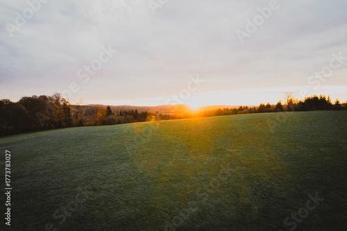 Morning Light Illuminates Rolling Meadows and Fall Foliage