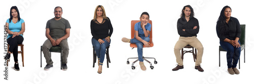 Front view of a group of Latin American people sitting on chair looking at a camera on white background