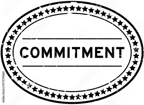 Grunge black commitment word oval rubber seal stamp on white background