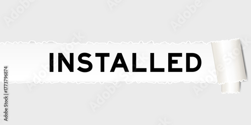 Ripped gray paper background that have word installed under torn part