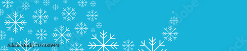 New Year snowflakes on a blue background, falling snow, Christmas and holiday	