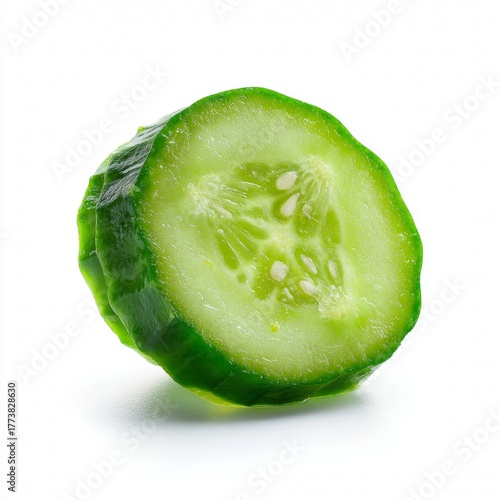 A fresh slice of cucumber, ready for consumption. The vibrant green color is a testament to its freshness and the healthy goodness it holds