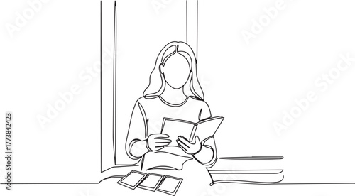 Continuous line drawing of a woman seated reading a book by the
