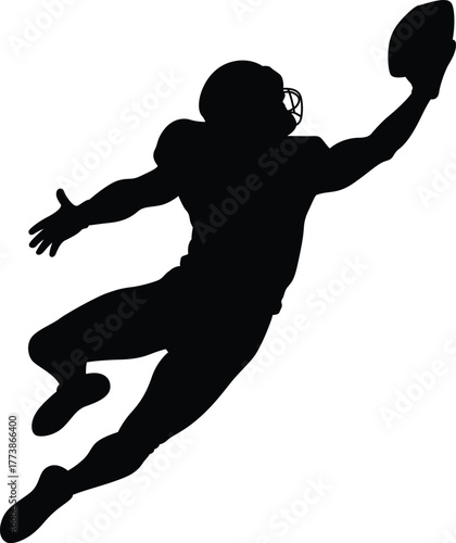Silhouette of an american football player leaping to catch a ball in a dynamic action pose
