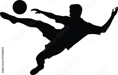 Dynamic silhouette of a soccer player kicking a ball in mid air during a game