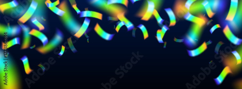 Rainbow holographic confetti on dark background for vibrant party atmosphere. Iridescent multicolored strips shimmer with metallic effect on black for festive celebration or birthday event design.