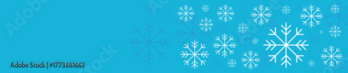 New Year snowflakes on a blue background, falling snow, Christmas and holiday	