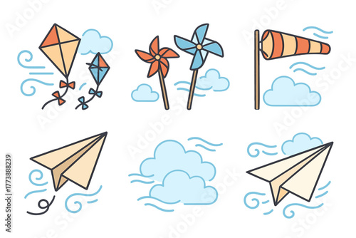 Kites pinwheels windsock and paper airplanes flying in the blue sky among clouds