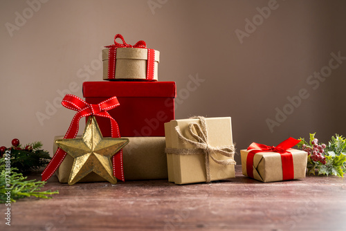 Wallpaper Mural Festive Christmas craft gift boxes with red bows on wooden background Torontodigital.ca