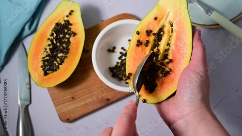 Papaya orange fruit cuted in halves, bright food photo