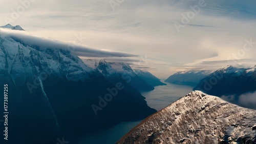 goldenhour ridge with rolling mist and snow-dusted slopes, warm low light and soft cloud movement creating intimate mood perfect for inspirational outdoor storytelling and hiking content