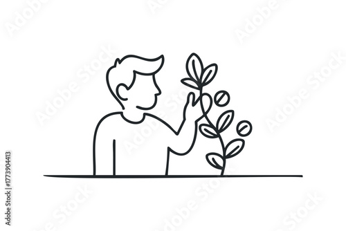 Person examining a growing plant with berries