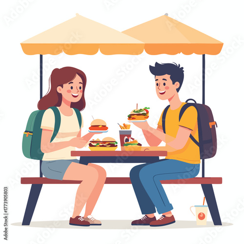 A young couple enjoys burgers and fries at an outdoor picnic table under umbrellas. They are smiling and have backpacks.