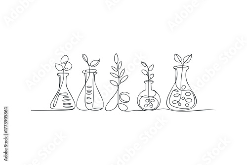 Laboratory flasks with sprouts growing from them