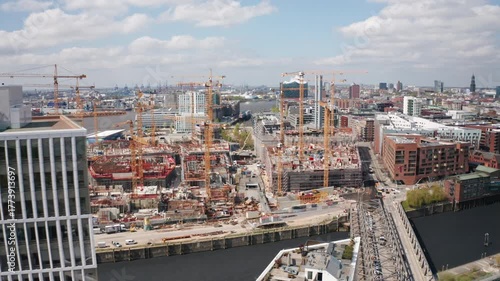 Aerial view of Hamburg’s extensive construction site, featuring cranes and new buildings, symbolizing urban economic growth and modern development in Germany and the European Union.