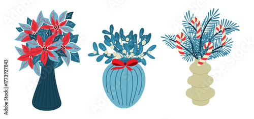 Christmas bouquets in vases with poinsettia, mistletoe and pine branches decorated with candy canes. Concept of holiday decoration, winter spirit and festive floral arrangement