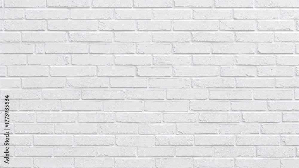 Naklejka premium A white brick wall with a clean, uniform appearance.