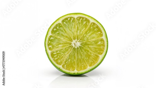 Lime cut in half isolated on white background. Fresh citrus fruit with green peel and juicy interior. Healthy and natural food concept.