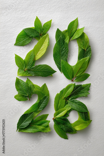 celebrate 2026 green leaves on white background, new years eve day, silvester, portrait format, photorealistic