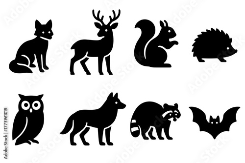 Collection of Stylized Animal Silhouettes Featuring Fox Deer Squirrel Hedgehog Owl Wolf Raccoon and Bat Against White Background Simple Vector Graphics