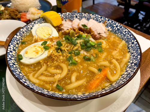 Pancit Lomi, a Filipino soup with noodles served here with fried belly pork and hard boiled egg.