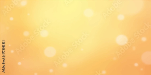 Bright, abstract golden light background with yellow and orange bokeh for a shiny Christmas or summer holiday design