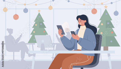 Happy woman using tablet and phone in a modern office decorated for Christmas holidays