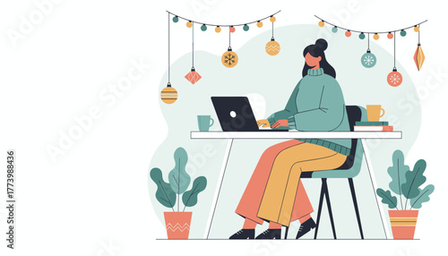 Woman working remotely on a laptop in a festive home office decorated with Christmas ornaments