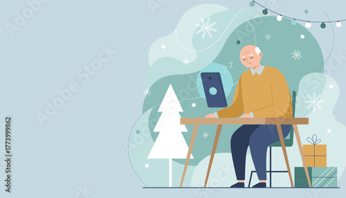Tired senior man falls asleep at his desk while using a tablet during the winter holiday season