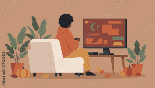 Cozy autumn gaming Person relaxing on sofa playing video games in a warm decorated living room