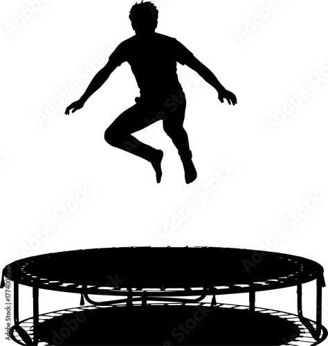 Dynamic silhouette of an energetic person caught in mid-air while jumping on a large round trampoline