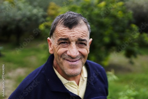 Slika na platnu A cheerful middle-aged man smiles and poses