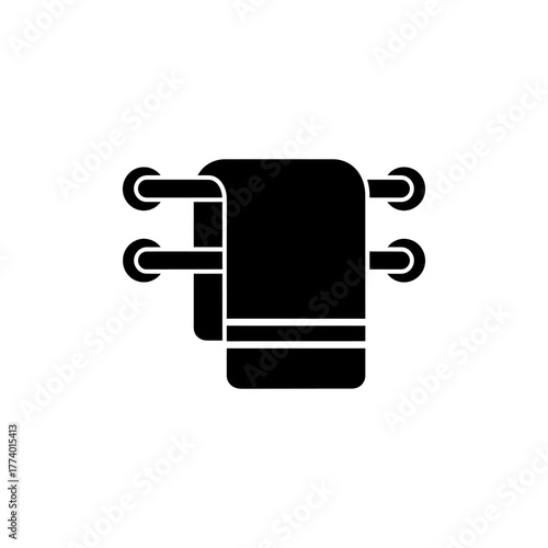 Clean towel hangs on a metal rack in a bathroom, ready for use after a shower, conveying a sense of hygiene and comfort.