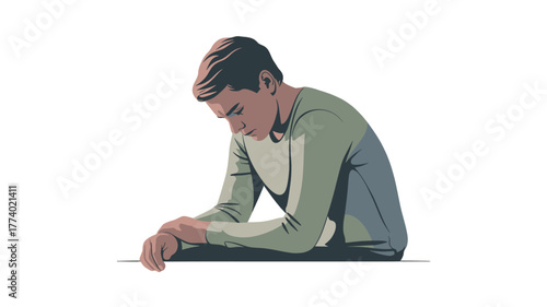 A man looking down in thought or sadness.