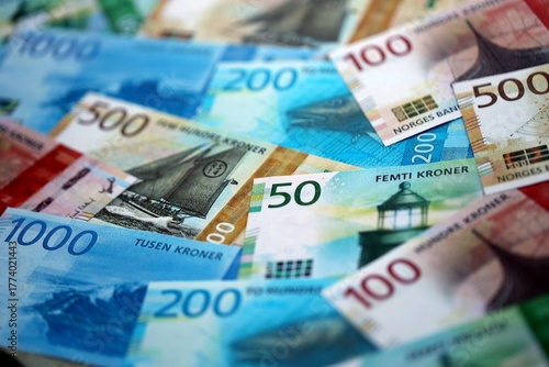 Norwegian Krone currency money bills. NOK currency banknotes in pile with different denomination close up