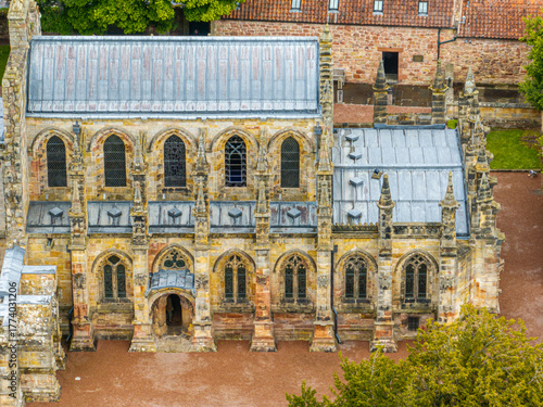 Aerial view of Rosslyn Chapel, it was founded in 1446 by Sir William St Clair. Rural Midlothian. Da Vinci Code movie. Ley lines and rose line. Edinburgh. Scotland. UK